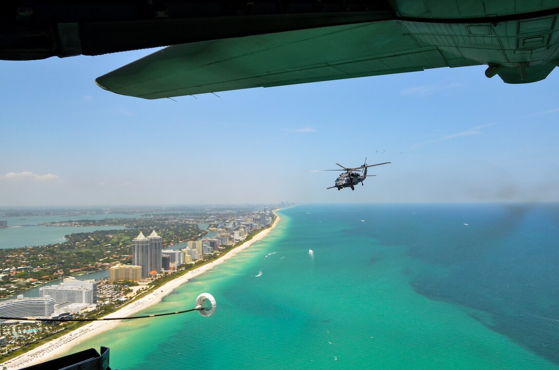 Citizen Airmen from the 920th Rescue Wing fly an HH-60G Pave Hawk helicopter over Miami Beach during the National Salute to America’s Heroes Air and Sea Show media day, May 26, 2017. Top tier U.S. military assets have assembled in Miami to showcase air superiority while honoring those who have made the ultimate sacrifice during the Memorial Day weekend. The 920th Rescue Wing, the Air Force Reserve’s only rescue wing, will headline the air show by demonstrating combat-search-and-rescue capabilities by teaming up with a HC-130P/N Combat King and four A-10 Thunderbolt II aircraft. (Photo by Senior Airman Brandon Kalloo Sanes)
