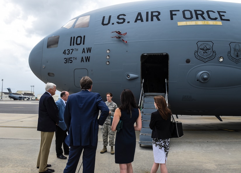 Senior officials from the Medical University of South Carolina, including MUSC president Dr. David Cole, far left, prepare to go inside a C-17 Globemaster III May 22, 2018, at Joint Base Charleston, S.C.