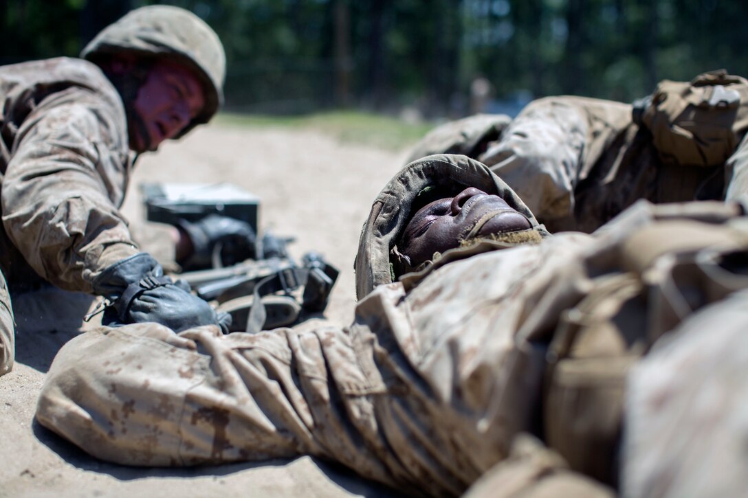A Marine Corps recruit acts as a notional casualty during the Crucible training.
