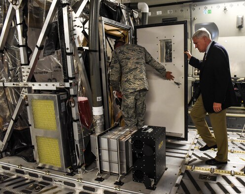 David Cole, right, Medical University of South Carolina president, prepares to step inside the Transportation Isolation System May 22, 2018, at Joint Base Charleston, S.C.