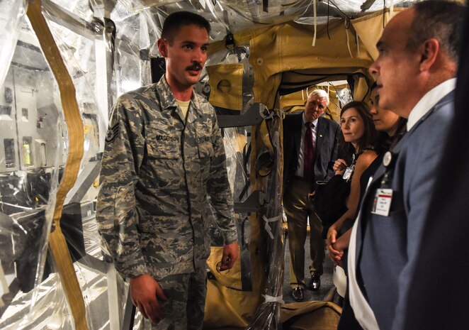 Senior officials from the Medical University of South Carolina receive a briefing from JB Charleston Airmen inside the Transportation Isolation System May 22, 2018, at Joint Base Charleston, S.C.