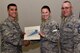 U.S. Air Force Col. Ricky Mills, 17th Training Wing commander, presents Tech. Sgt. Jessica Whitney, 316th Training Squadron instructor, their certificate of selection with Chief Master Sgt. Daniel Stein, 17th TRW command chief, during a Master Sergeant release party at the Event Center on Goodfellow Air Force Base, Texas, May 25, 2018. Goodfellow held the party to notify the selected promotees and to give fellow wingmen and friends an opportunity to congratulate them on their success. (U.S. Air Force photo by Senior Airman Randall Moose)