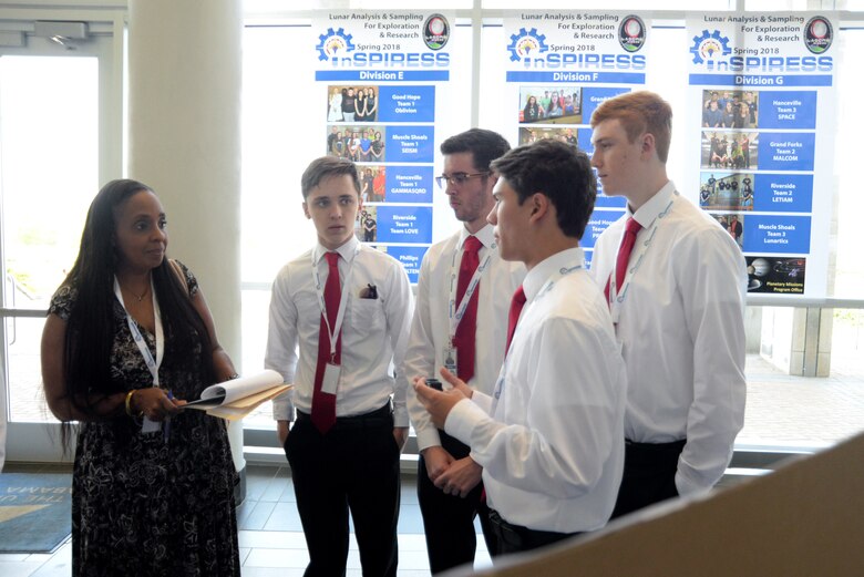 Students from Sparkman High School explain their scientific payload project May 11, 2018, to Lori Cordell-Meikle, chief of Internal Review for Huntsville Center, as part of the Innovative System Project for the Increased Recruitment of Emerging STEM Students at the University of Alabama in Huntsville.