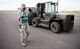 Senior Airman Diego Villanueva, 92nd Logistics Readiness Squadron petroleum, oil and lubricants journeyman, marshals a forklift during an exercise at Fairchild Air Force Base, Washington, May 2, 2018. The Cargo Deployment Function process involves more than just paperwork; it involves preparing baggage pallets, marshalling and driving forklifts, weighing and measuring cargo and checking hazardous material.  (U.S. Air Force Photo/Senior Airman Sean Campbell)