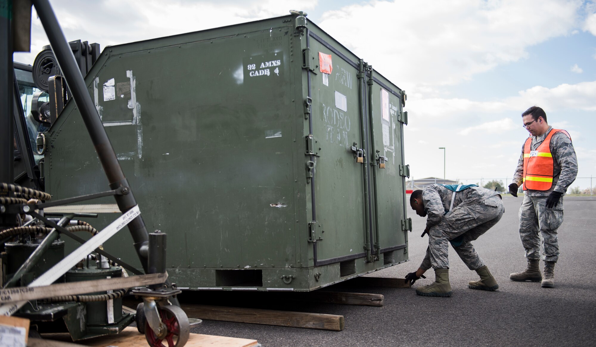 92nd Logistics Readiness Squadron Airmen conduct a cargo load during an exercise at Fairchild Air Force Base, Washington, May 2, 2018. Team Fairchild practiced their ability to perform during contingency operations, April 30 through May 11, giving personnel the hands-on experience needed to effectively deploy Airmen and assets downrange at a moment’s notice. (U.S. Air Force Photo/Senior Airman Sean Campbell)