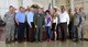 301st Fighter Wing members and community leaders come together for a group photo, May 18, 2018, at Naval Air Station Fort Worth Joint Reserve Base, Texas. The photo was at the conclusion of a wing overview given to 12 civic leaders who were inducted as honorary commanders earlier this year. (U.S. Air Force photo by Tech. Sgt. Charles Taylor)