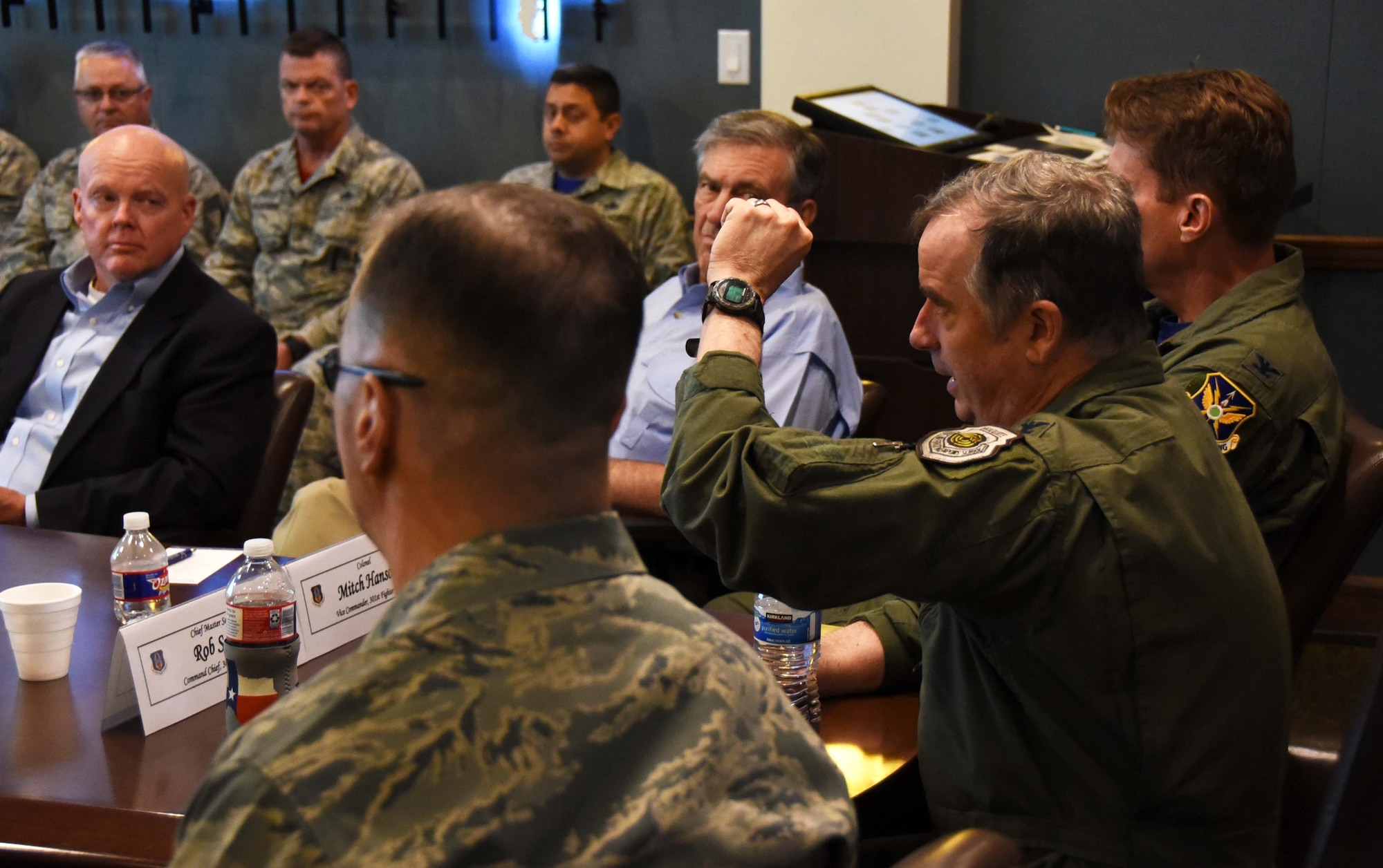 Col. Gregory C. Jones, 301st Fighter Wing commander, gives a briefing to 12 honorary commanders during a wing overview event, May 18, 2018, at Naval Air Station Fort Worth Joint Reserve Base, Texas. The event's goal was to enhance the understanding of the wing's mission and capabilities for those recently inducted into the Honorary Commanders' Program. (U.S. Air Force photo by Tech. Sgt. Charles Taylor)