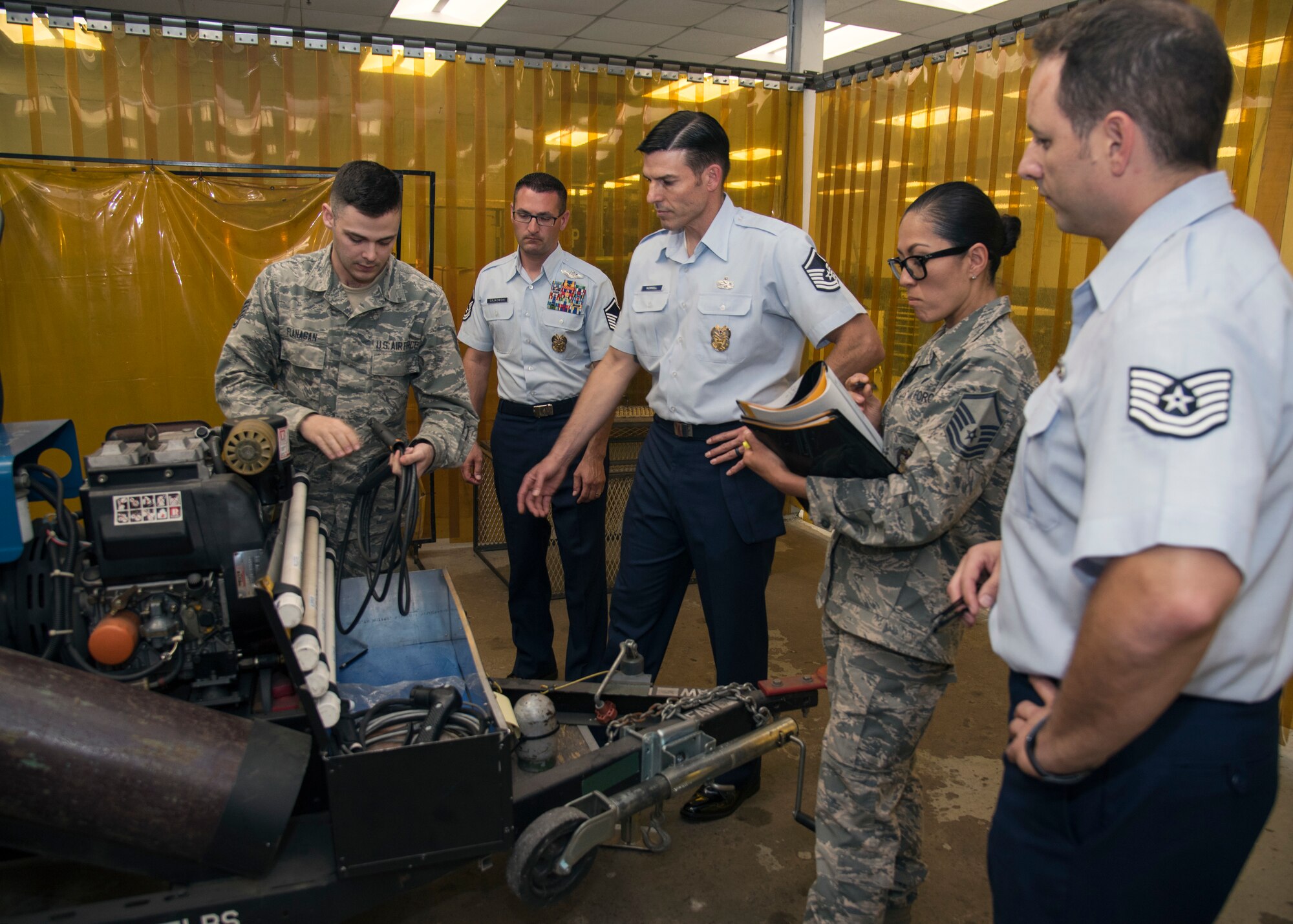 U.S. Air Force Staff Sgt. Andrew Flanagan, left, aircraft metals technician craftsman assigned to the 6th Maintenance Squadron, briefs 6th Air Mobility Wing Inspector General inspectors, during a Horizontal Inspection at MacDill Air Force Base, Fla., April 30, 2018. This inspection, was part of a month-long, 15 unit, wing-wide readiness assessment.