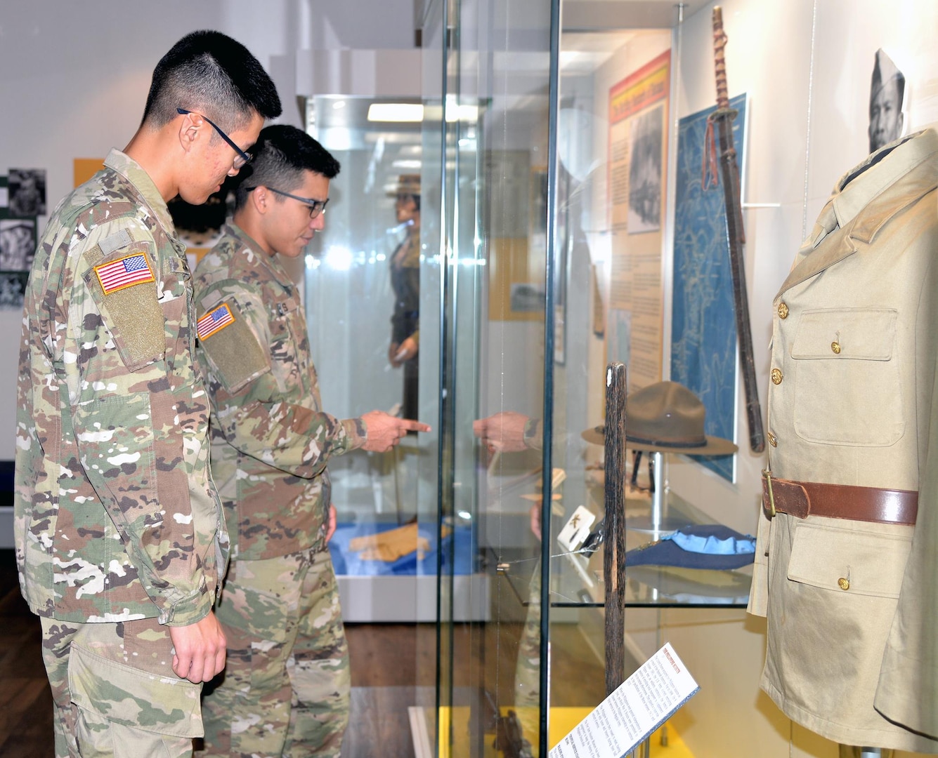 Army Pfc. Class Min Jung (left) and Army Spc. Angel Torres (right) view a historical display at the Fort Sam Houston Museum. Located in the historic Quadrangle, the museum contains six rooms of exhibits, displays and artifacts on the history of Fort Sam Houston and a reference library and archives.
