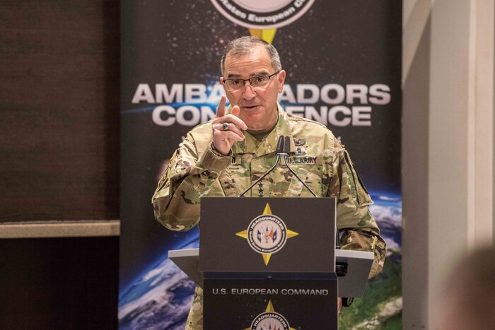 Army Gen. Curtis M. Scaparrotti speaks at a lectern.