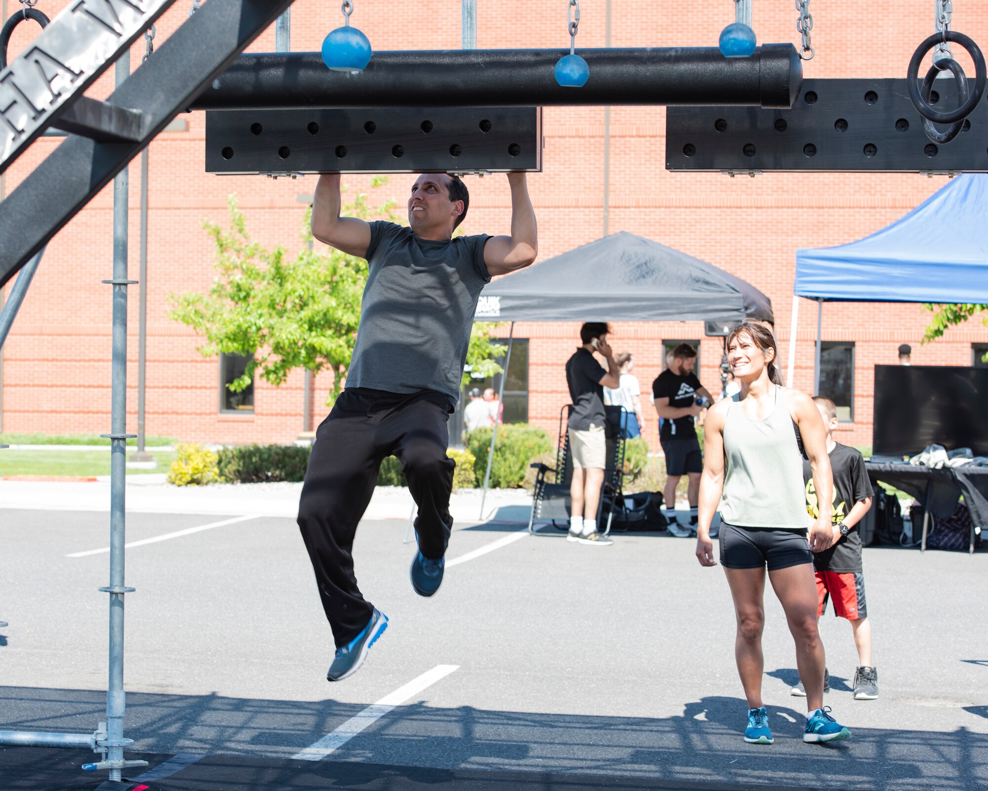 2nd Lt. Brian Gregory, a logistics readiness officer with the 141st Air Refueling Wing, tests his skills on the “cliff hanger” obstacle on the Alpha Warrior Battle Rig May 24, 2018 at Fairchild Air Force Base, Wash. The Alpha Warrior Battle Rig is 10 feet wide, 15 feet tall and 30 feet long and consists of eight obstacles to test participants strength and endurance mentally and physically. (U.S. Air National Guard photo by Staff Sgt. Rose M. Lust)