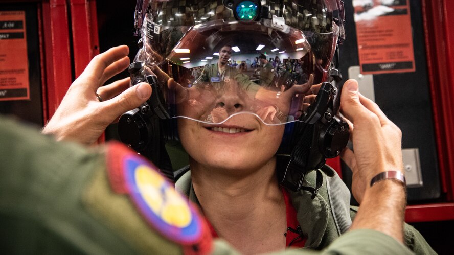 Micheal Kay tries on a pilot's F-35A helmet, May 24, 2018, at Hill Air Force Base, Utah. Eight children and their parents from Make-A-Wish Utah visited Hill for the "Pilot for a Day" program. The children toured the base, visited with pilots and "flew" in an F-35A cockpit trainer during the event. (U.S. Air Force photo by R. Nial Bradshaw)
