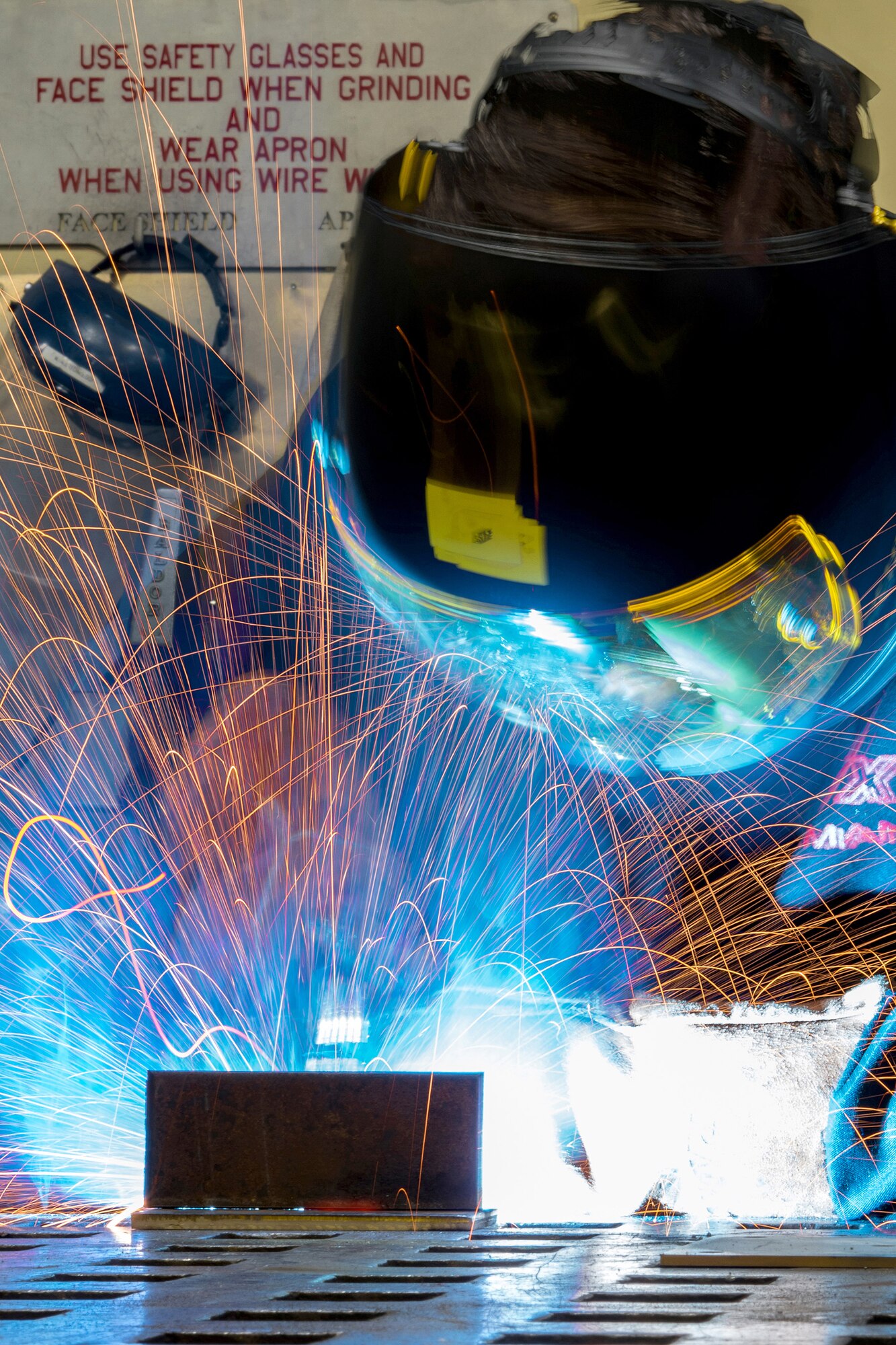 Airman Dalton Sturtz, a native of Seguin, Texas, an aircraft metals technology journeyman assigned to the 3rd Maintenance Squadron, practices welding a metal plate in the metals fabrication shop on Joint Base Elmendorf-Richardson, Alaska, May 9, 2018. Aircraft Metals Technology Airmen measure broken or worn parts, draw working sketches, make templates, perform precision grinding remove poisonous or corrosive deposits from parts, and write programs for machines using manual and computer-aided manufacturing.