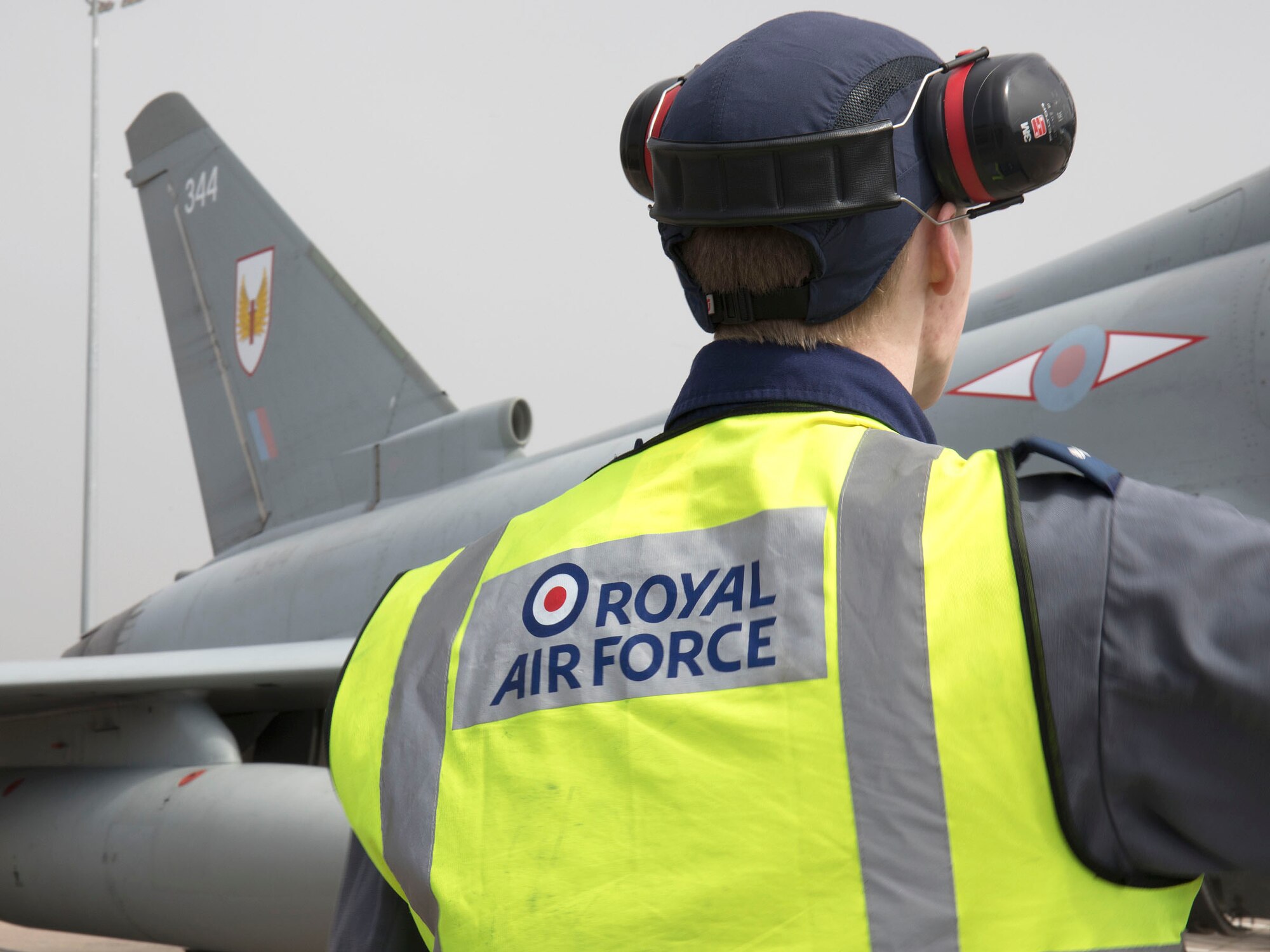 A Royal Air Force crew chief marshals a Eurofighter Typhoon assigned to the RAF 1 Squadron  at RAF Lossiemouth, Scotland, in support of Exercise POINTBLANK May 24, 2018. The objective is to prepare Coalition warfighters for a highly contested fight against near-peer adversaries by providing a multi-dimensional battle-space to conduct advanced training in support of U.S. and U.K. national interests. (Courtesy photo/ Crown Copyright)