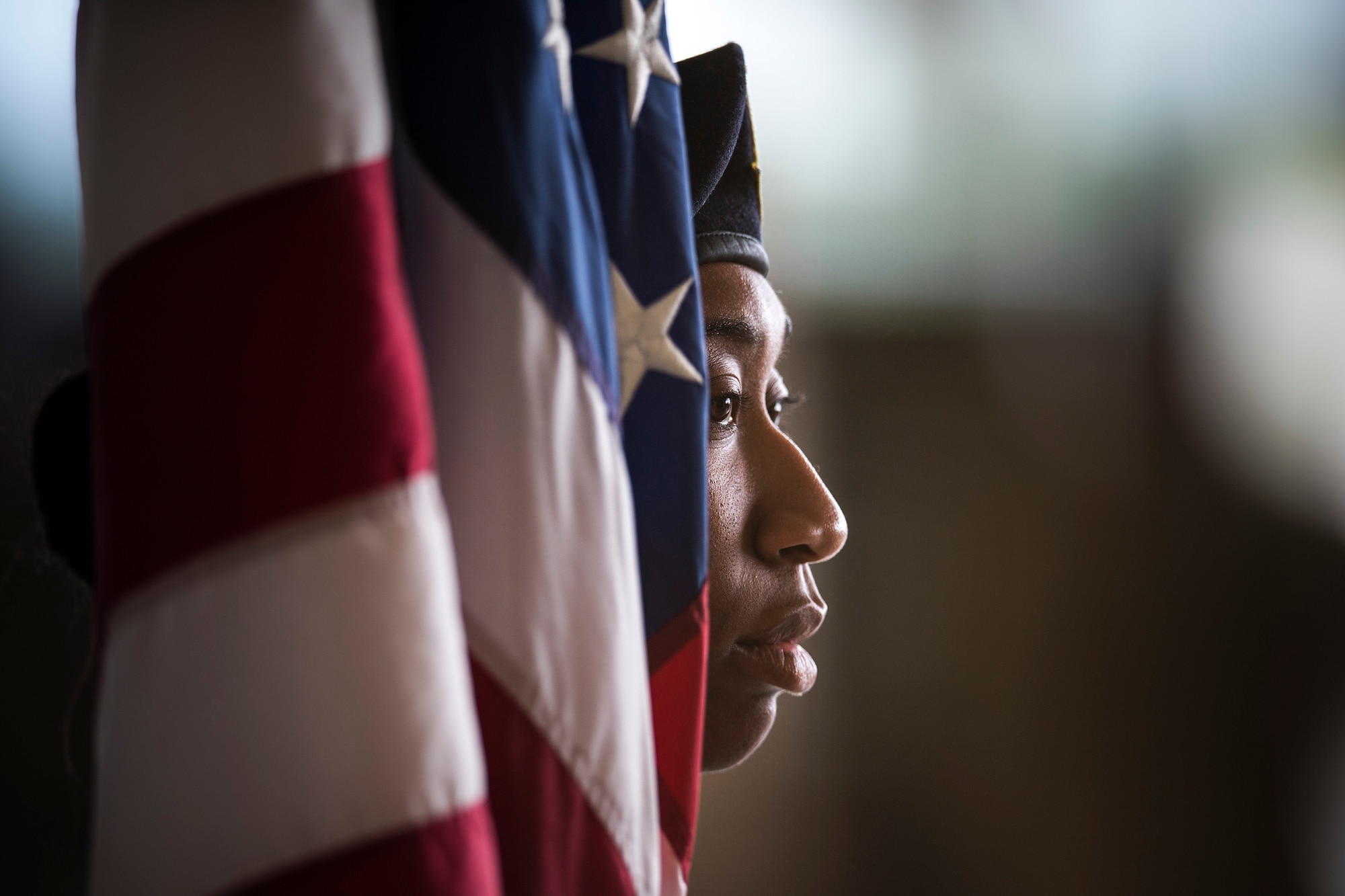 An Airman from the 822nd Base Defense Squadron holds the flag at a change of command ceremony, May 23, 2018, at Moody Air Force Base, Ga. The event marks the beginning of a new regime as Col. Paul Birch becomes the 7th commander of the 93d Air Ground Operations Wing and its battlefield Airmen. (U.S. Air Force photo by Staff Sgt. Ryan Callaghan)