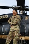 2nd Lt. Liliana Chavez Uribe poses in front of a helicopter at McAllen International Airport, April 24, 2018. Chavez, now an Aeromedical Evacuation Officer, 2nd Battalion, 149th Aviation Regiment, General Support Aviation Battalion, who flies Black Hawks and Lakotas, said that her accomplishments are far beyond what her six-year-old self could have imagined.