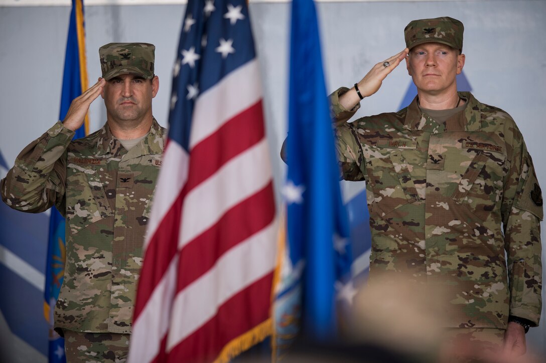 Col. Jeffrey Valenzia, left, outgoing 93d Air Ground Operations Wing commander, and Col. Paul Birch, incoming commander, salute the color guard at the AGOW change of command ceremony, May 23, 2018, at Moody Air Force Base, Ga. The event marks the beginning of a new regime as Birch becomes the 7th commander of the Wing and its battlefield Airmen. (U.S. Air Force photo by Staff Sgt. Ryan Callaghan)