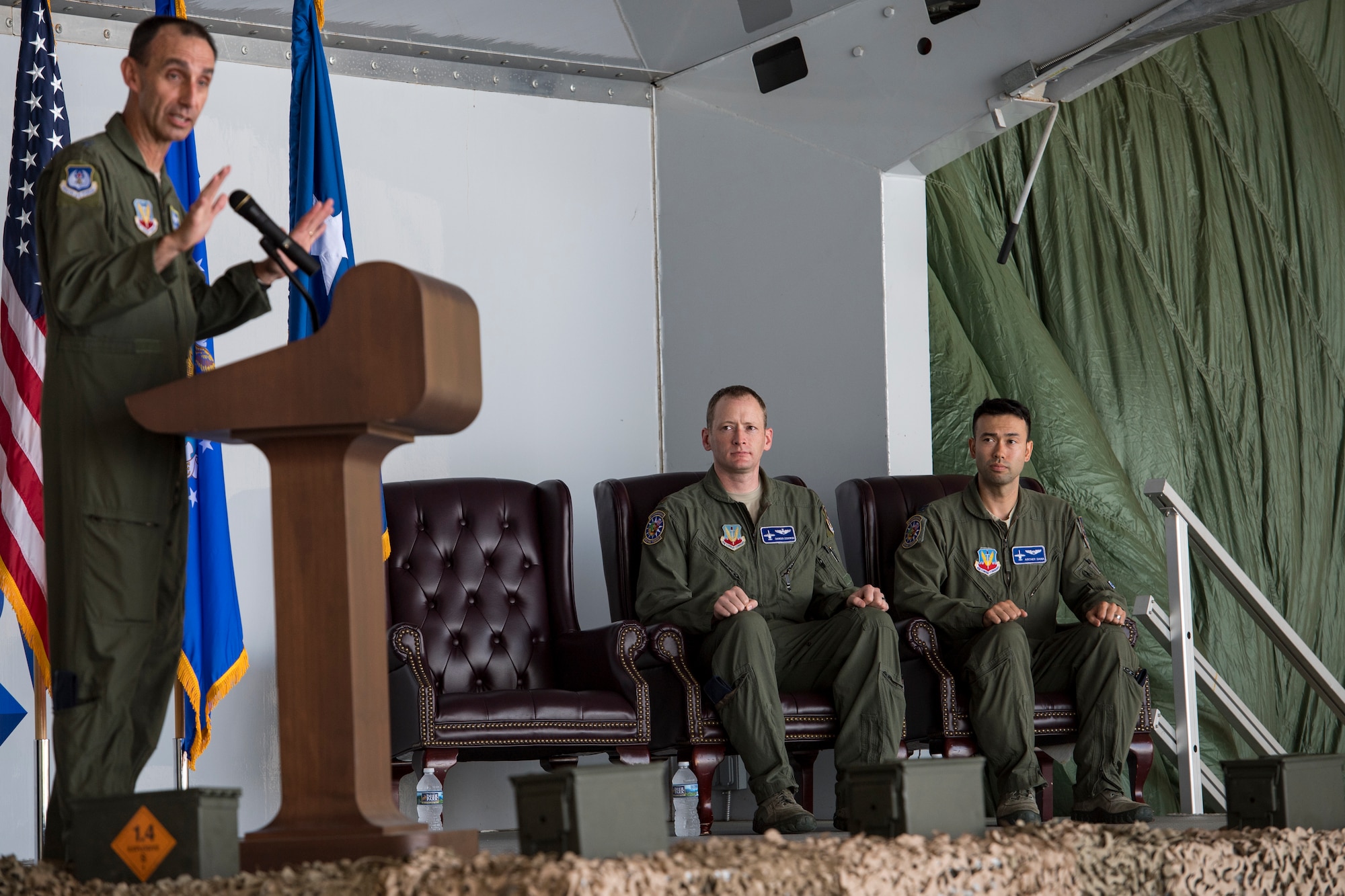 U.S. Air Force Maj. Gen. Scott J. Zobrist, left, 9th Air Force commander, speaks during an award ceremony, May 23, 2018, at Moody Air Force Base, Ga. The ceremony was held to honor Maj. Matthew “Chowder” Cichowski, center, and Capt. William “Archer” Dana, 74th Fighter Squadron A-10 Thunderbolt II pilots, who each received a Distinguished Flying Cross.  The Distinguished Flying Cross is awarded to any officer or enlisted member of the U.S. Armed Forces who distinguishes themselves in support of operations by heroism or extraordinary achievement while participating in aerial flight. (U.S. Air Force photo by Senior Airman Janiqua P. Robinson)