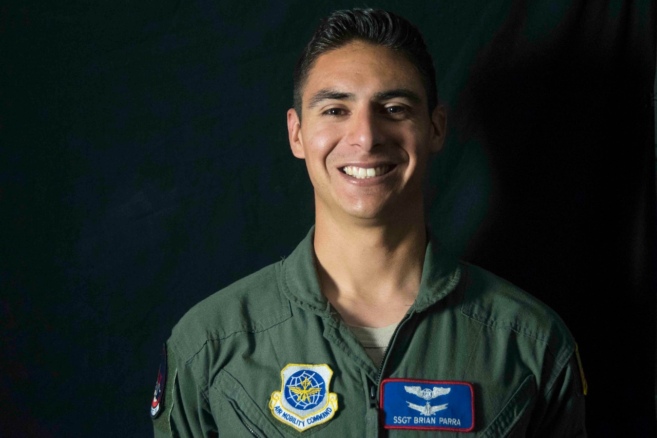 Airman poses wearing flight suit.