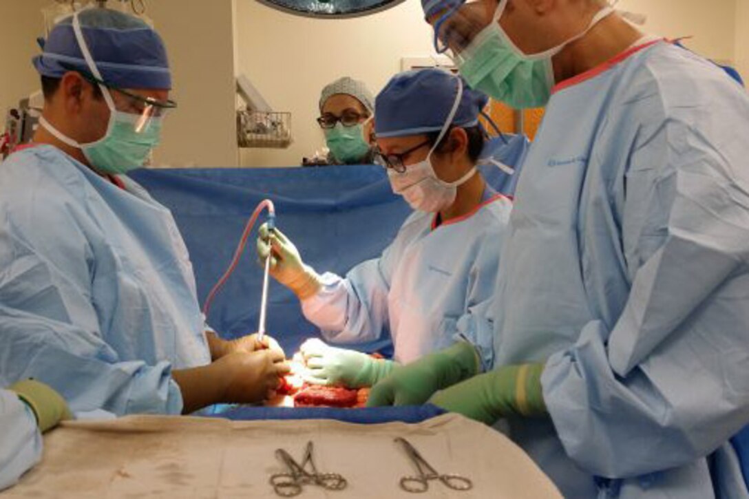 Dr. Anne Fabrizio, second from right, performs surgery in Washington, D.C