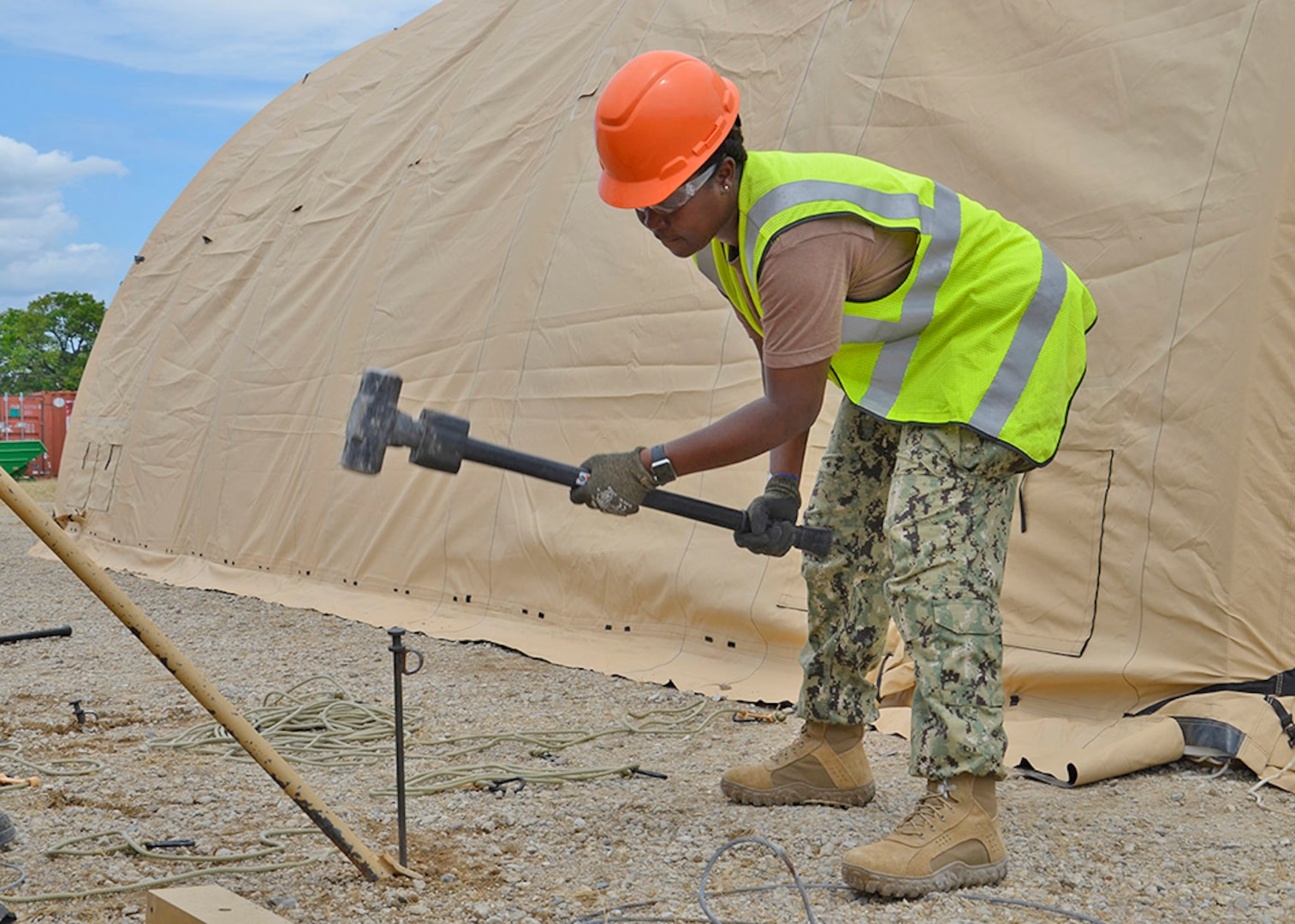 170615-D-YU183-072 - Navy Boatswain’s Mate 1st Class Annalisa Brown of Disposal Support Unit 2 erects a portable shelter at Fort Custer in Michigan during the 2017 Overseas Contingency Operations Readiness Training. This year, about 70 expeditionary civilians and military reserve logisticians will build sites and service real-life customers at installations about three hours apart in mid-June. [Released]