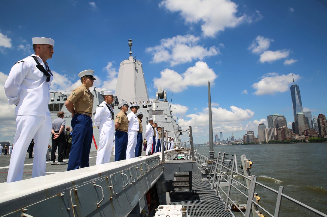 U.S. Marines and Sailors ‘man the rails’ aboard San Antonio-class amphibious transport dock USS Arlington during the parade of ships commencing Fleet Week New York, May 23, 2018. Marines, Sailors, and Coast Guardsmen are in New York to interact with the public, demonstrate capabilities and teach the people of New York about America’s sea services.