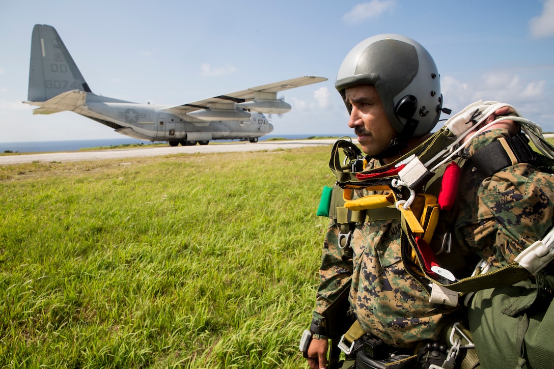 Gunnery Sgt. Richard D. Madrid, an airborne, air delivery specialist with 3rd Air Delivery Platoon, Landing Support Company, 3rd Transportation Support Battalion, prepares to board a C-130 after free-falling May 21, 2018, on Ie Shima, Okinawa, Japan. The Marines conducted air drop operations dropping a type-five platform, door bundles, free fall and static line jumpers, and the Polaris MRZR onto the island. 3rd Marine Logistics Group Marines worked alongside Marines with 3rd Reconnaissance Battalion, 3rd Marine Division, during the regularly scheduled training evolution to complete their first ever successful drop of a Polaris MRZR from a C-130. Madrid is a native of Monterey Park, California.