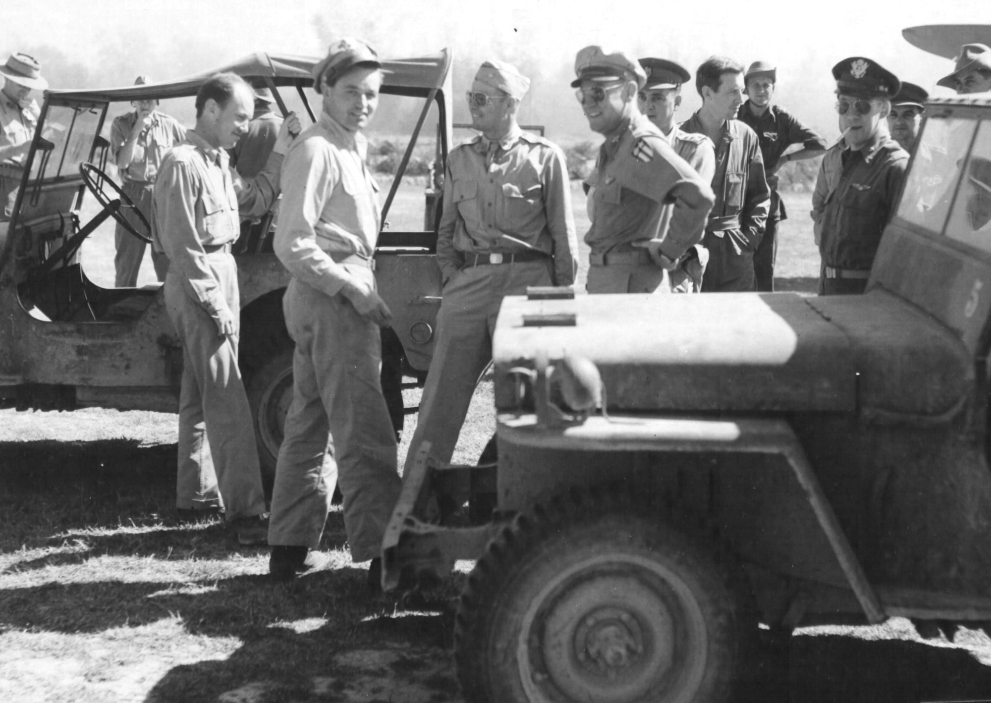 Col. John R. Alison, Col. Philip Cochran and Brig. Gen. William D. Old, commanding general of the Troop Carrier Commando, await "D-Day" take off of the 1st Air Commando Force gliders at Lalaghat, India. (Historical photo)