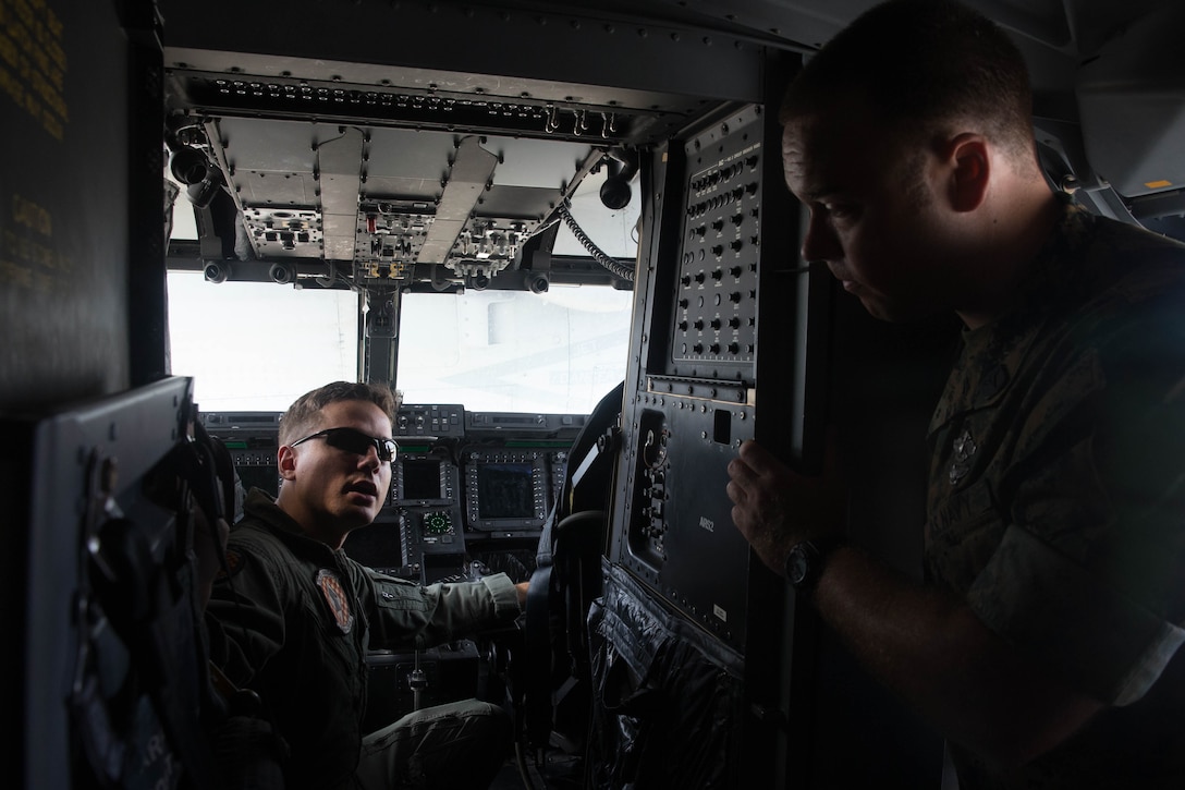 Petty Officer 3rd Class Emilie Evans, hospital corpsman, 22nd Marine Expeditionary Unit, directs the placement of a simulated casualty during the Tactical Evacuation Course at Camp Lejeune, N.C., May 23, 2018. The Tactical Evacuation Course trained hospital corpsman the proper techniques to use in unusual evacuation environments.  (U.S. Marine Corps photo by Lance Cpl. Tawanya Norwood)