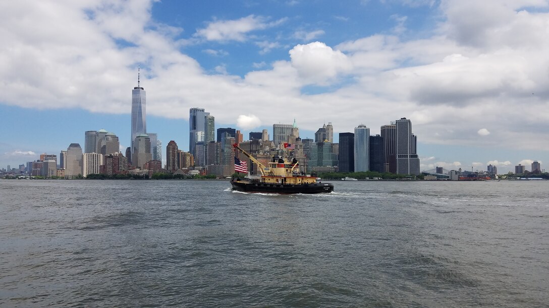 DCV Hayward transits New York Harbor with Lower Manhattan in the background