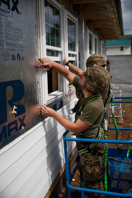 U.S. Marine Lance Cpl. Wyatt Miller, combat engineer with Engineer Company C, 6th Engineer Support Battalion, 4th Marine Logistics Group, and British Army Spr. Daniel J. Noad, British commando with 131 Commando Squadron Royal Engineers, British Army, measure window frames at a construction site during exercise Red Dagger at Fort Indiantown Gap, Pa., May 23, 2018.