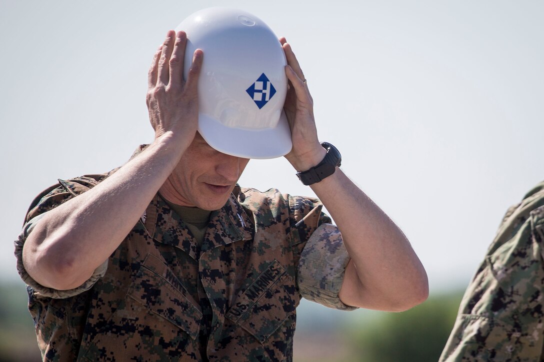 U.S. Marine Col. Steven J. White, the commanding officer of 23rd Marine Regiment, 4th Marine Division, participates in the groundbreaking ceremony of a brand new Reserve Training Center hosting Company E, 2nd Battalion, 24th Marines, 23rd Marine Regiment, 4th Marine Division, and the Navy Operational Support Center in Des Moines, Iowa, May 24, 2018.