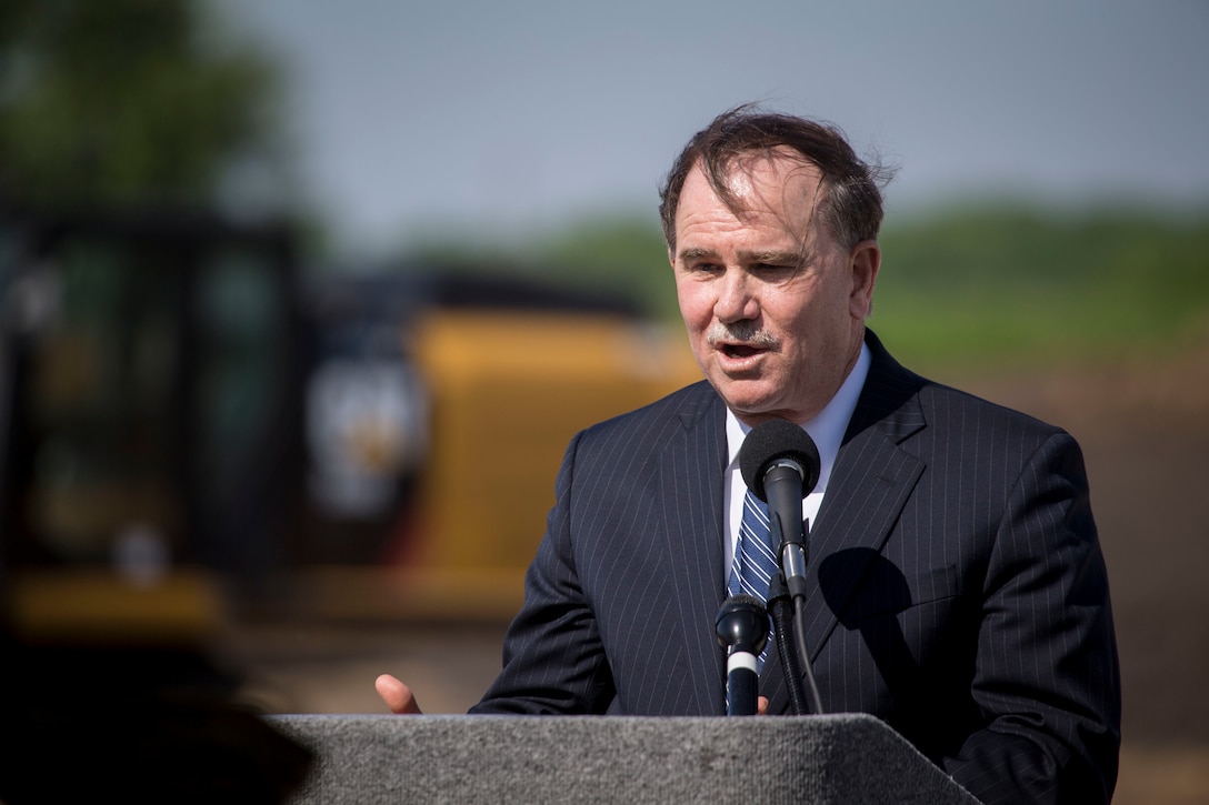 Mr. Dennis Biddick, Deputy Assistant Secretary, Navy Reserve, speaks to guests during the groundbreaking ceremony of a brand new Reserve Training Center hosting Company E, 2nd Battalion, 24th Marines, 23rd Marine Regiment, 4th Marine Division, and the Navy Operational Support Center in Des Moines, Iowa, May 24, 2018.