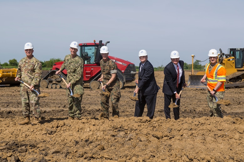 Honored guests participate in the groundbreaking of a brand new Reserve Training Center in Des Moines, Iowa, May 24, 2018. The construction of the new joint Navy and Marine Corps Reserve Training Center hosting Company E, 2nd Battalion, 24th Marines, 23rd Marine Regiment, 4th Marine Division, and the Navy Operational Support Center in Des Moines, Iowa, May 24, 2018.