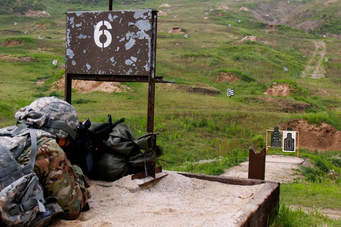 A soldier engages a target at the stress shoot event.