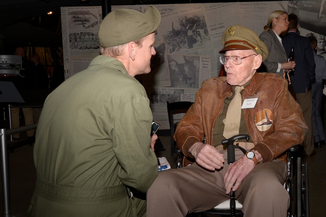 Retired Col. Howard Hunt, a 96-year-old World War II B-17 pilot veteran, talks with a fan during the Memphis Belle private exhibit opening ceremony May 16, 2018, at the National Museum of the U.S. Air Force, Ohio. Hunt piloted the Memphis Belle aircraft during the homecoming and war bond tour in 1943. (U.S. Air Force photo by Staff Sgt. Megan Friedl)