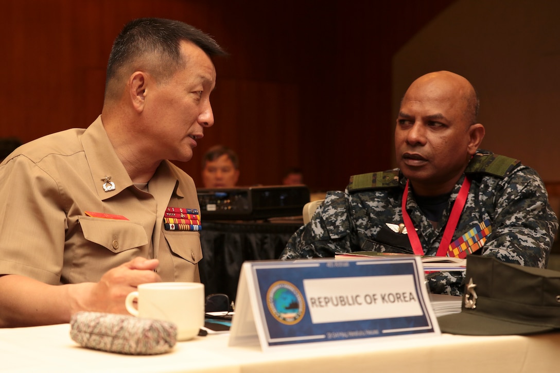 Brig. Gen. Kim Taesung, left, chief of staff, Republic of Korea Marine Corps and Rear Adm. Udeni Indranatha Serasinghe, Director General land Operation and Director, Sri Lanka Navy Infantry and Navy Marine, speak during the Pacific Amphibious Leaders Symposium (PALS) in Honolulu, Hawaii, May 21-24, 2018. PALS brings together senior leaders of allied and partner militaries with significant interest in the security and stability of the Indo-Pacific region to discuss key aspects of maritime/amphibious operations, capability development, crisis response and interoperability. (U.S. Marine Corps photo by Cpl. Maximiliano Rosas)