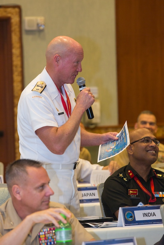 Royal Canadian Navy Commodore Dan MacKeigan, strategic advisor commander, Canadian Naval Staff Ottawa, asks a question during the Pacific Amphibious Leaders Symposium (PALS) 2018 in Honolulu, Hawaii, May 24, 2018.