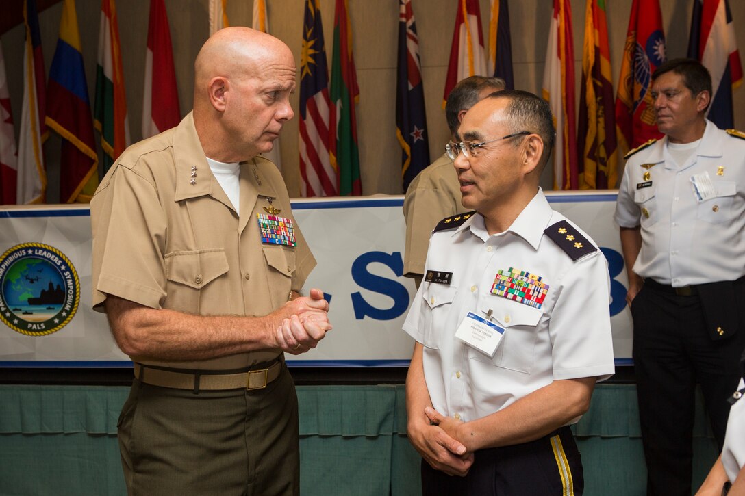 U.S. Marine Corps Lt. Gen. David H. Berger, commander, U.S. Marine Corps Forces, Pacific, speaks with Japan Self Defense Force Lt. Gen. Hidehisa Tokuda, commandant, Fuji School, during the Pacific Amphibious Leaders Symposium (PALS) 2018 in Honolulu, Hawaii, May 24, 2018. The intent of PALS is to strengthen interoperability and working relationships between partner and allied militaries across a wide range of operations. Senior military leaders will use PALS as a platform to build upon already-established military-to-military relationships as well as hone their amphibious capabilities. (U.S. Marine Corps photo by Cpl. Patrick Mahoney)