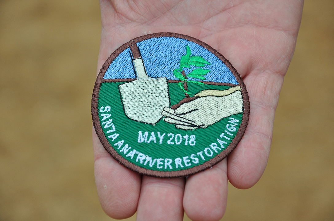 Brian Petree, deputy city manager for the City of Norco, California, displays a batch that was created to hand out to Boy Scouts and Cub Scouts during a tree-planting event May 12 in Norco, California.