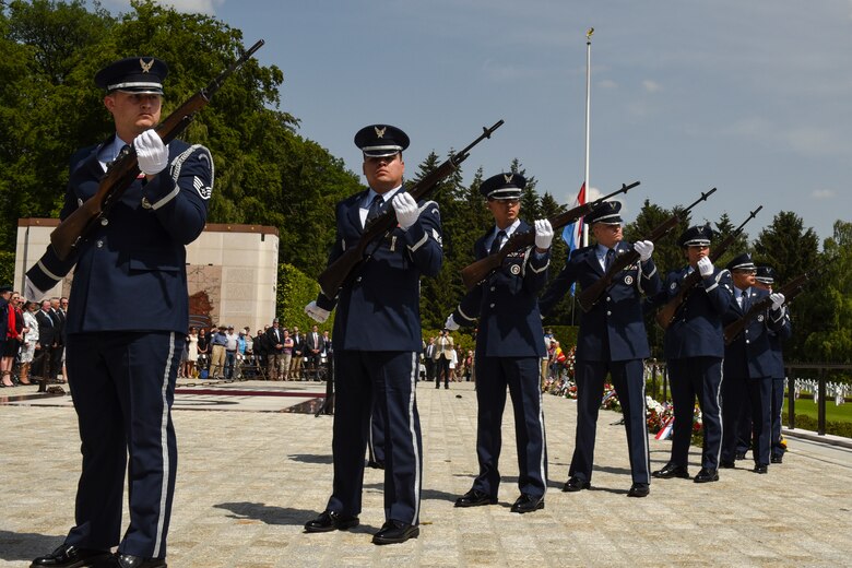 Members of the Spangdahlem Air Base Honor Guard perform a three volley salute during the Memorial Day Ceremony at Luxembourg American Military Cemetery in Hamm, Luxembourg, May 26, 2018. The base's Airmen also served as a ceremonial flight in service dress, caretakers of the cemetery's Luxembourg and U.S. flags, and escorts for guests to lay wreaths. (U.S. Air Force photo by Senior Airman Dawn M. Weber)
