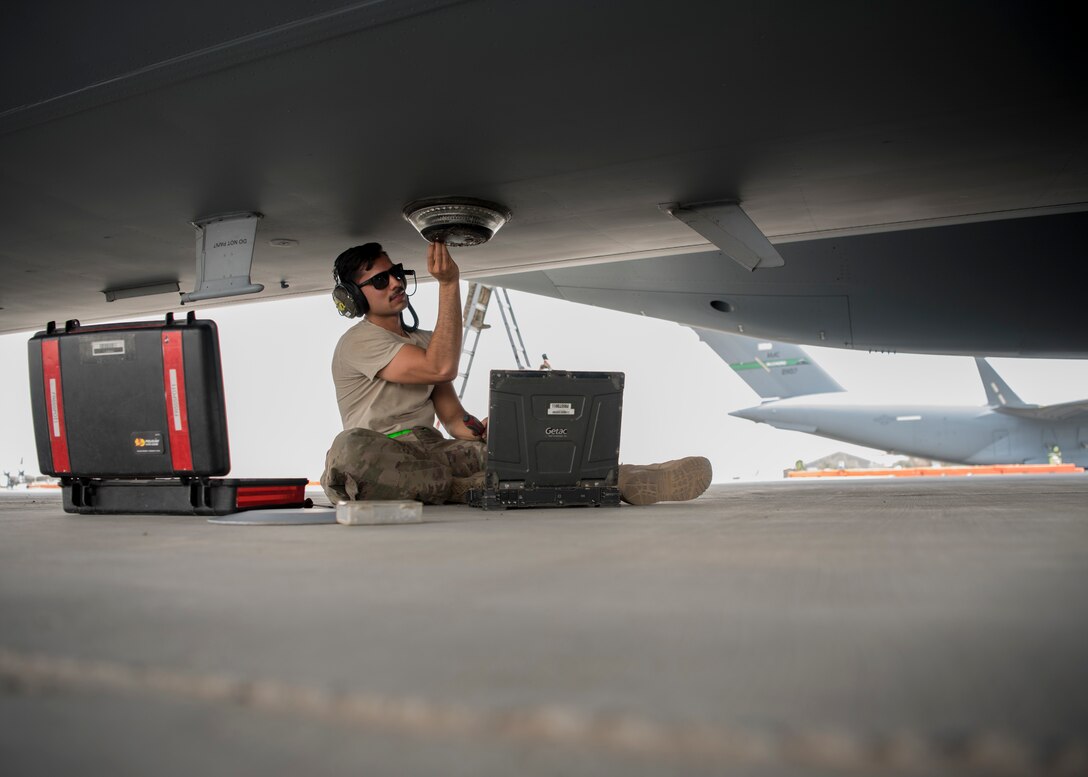 Senior Airman John Acevedo, 5th Expeditionary Air Mobility Squadron maintainer, inspects an instrument on a C-17 Globemaster III aircraft May 23, 2018, at an undisclosed location in Southwest Asia. As a tenant unit under the 386th Air Expeditionary Wing, the 5th EAMS maintains staged C-17 Globemaster III aircraft in addition to providing support for transient aircraft flying in and out of Iraq, Afghanistan and other countries in Southwest Asia. (U.S. Air Force photo by Staff Sgt. Christopher Stoltz)