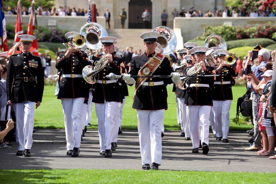 Marines with the 2nd Marine Division Band march off after the ceremony of The Battle of Belleau Wood Centennial at the Aisne-Marne American Cemetery, France, May 27, 2018. The Ceremony commemorated the sacrifices made during WWI.