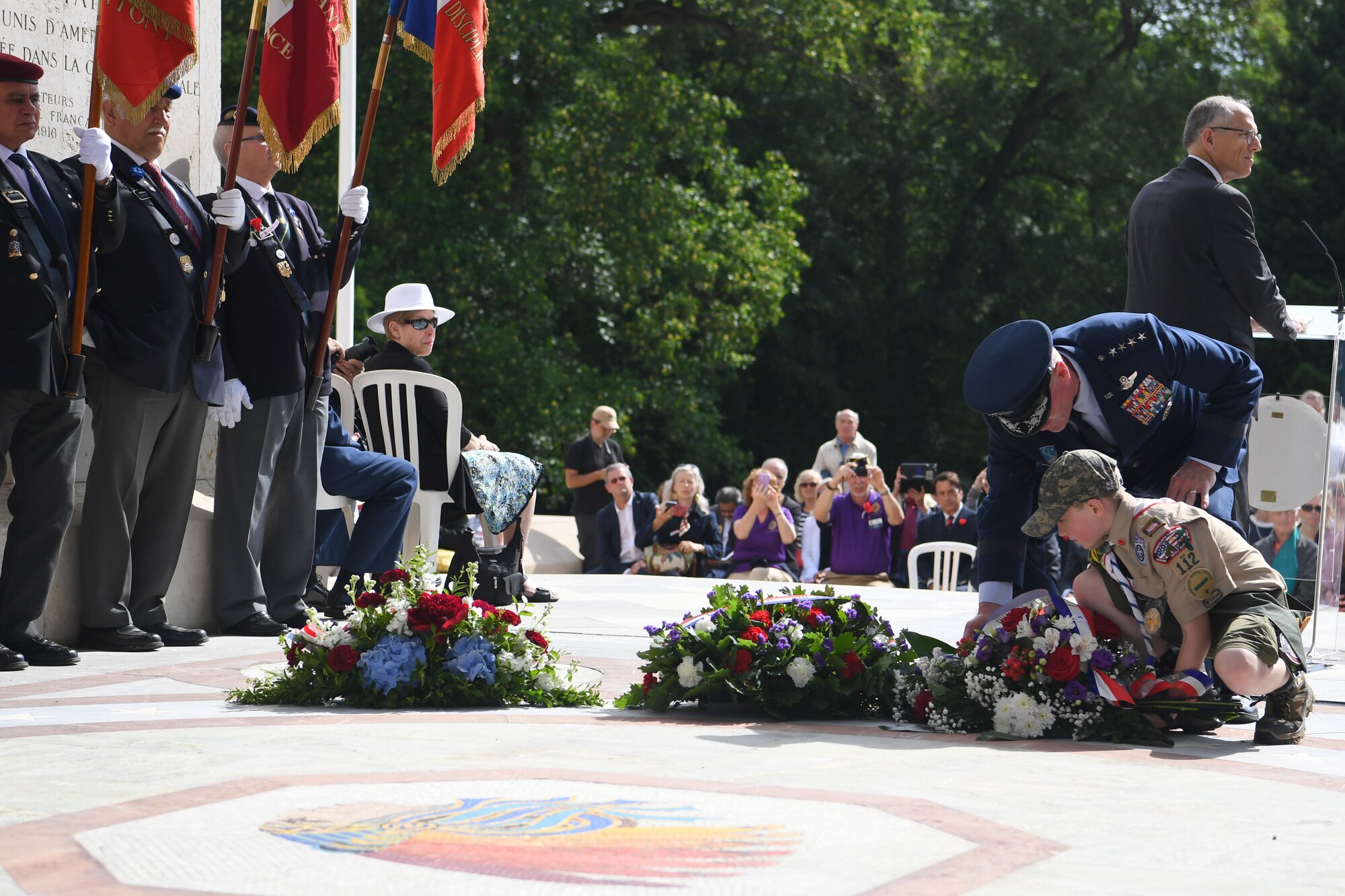 Gen Wolters and a local boy scout lay a memorial wreath at the Lafayette Escadrille Memorial