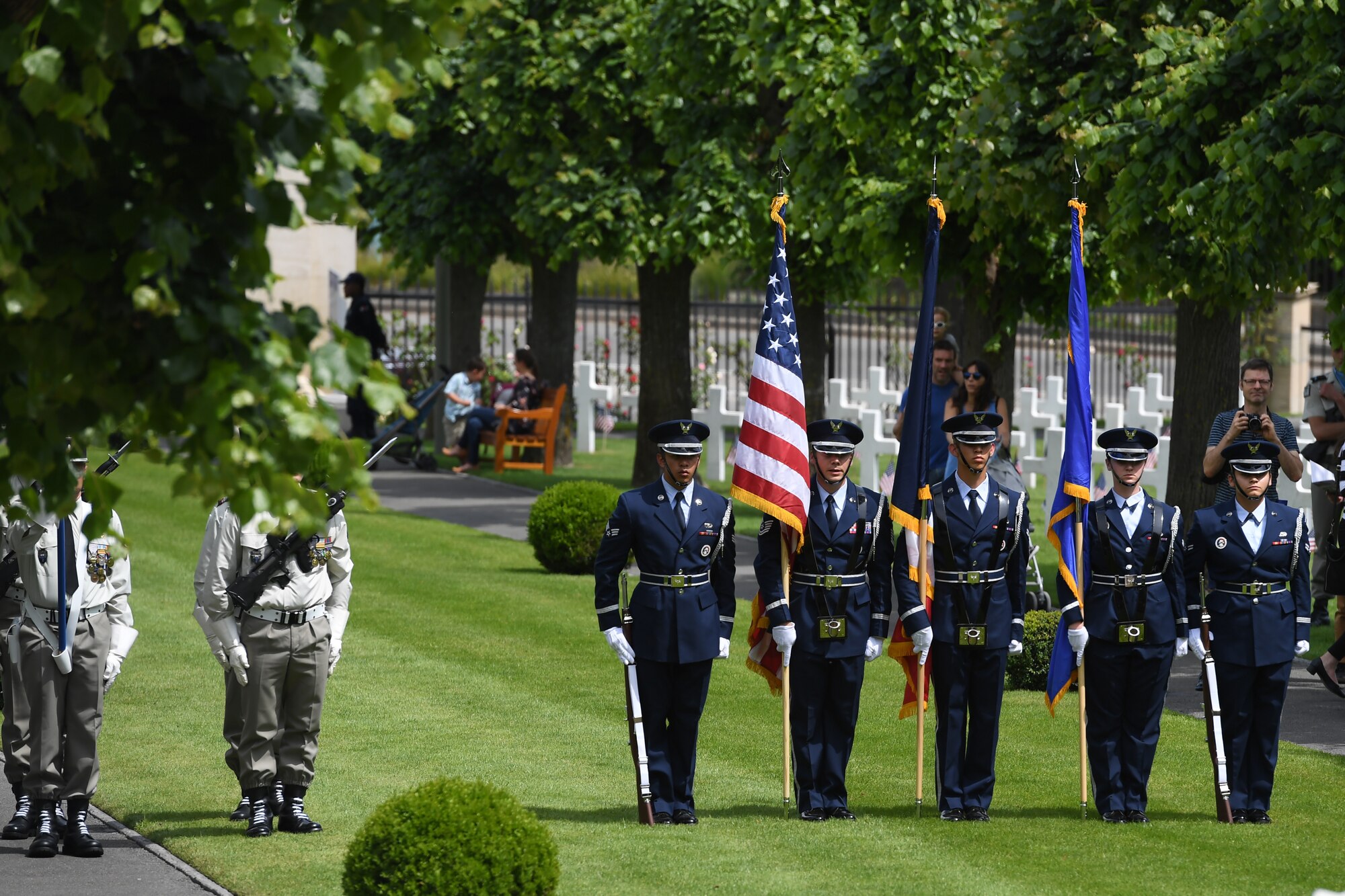An honor guard detail from Spangdahlem Air Base, Germany, participates in a Memorial Day ceremony alongside their French counterparts at Suresnes American Cemetery.