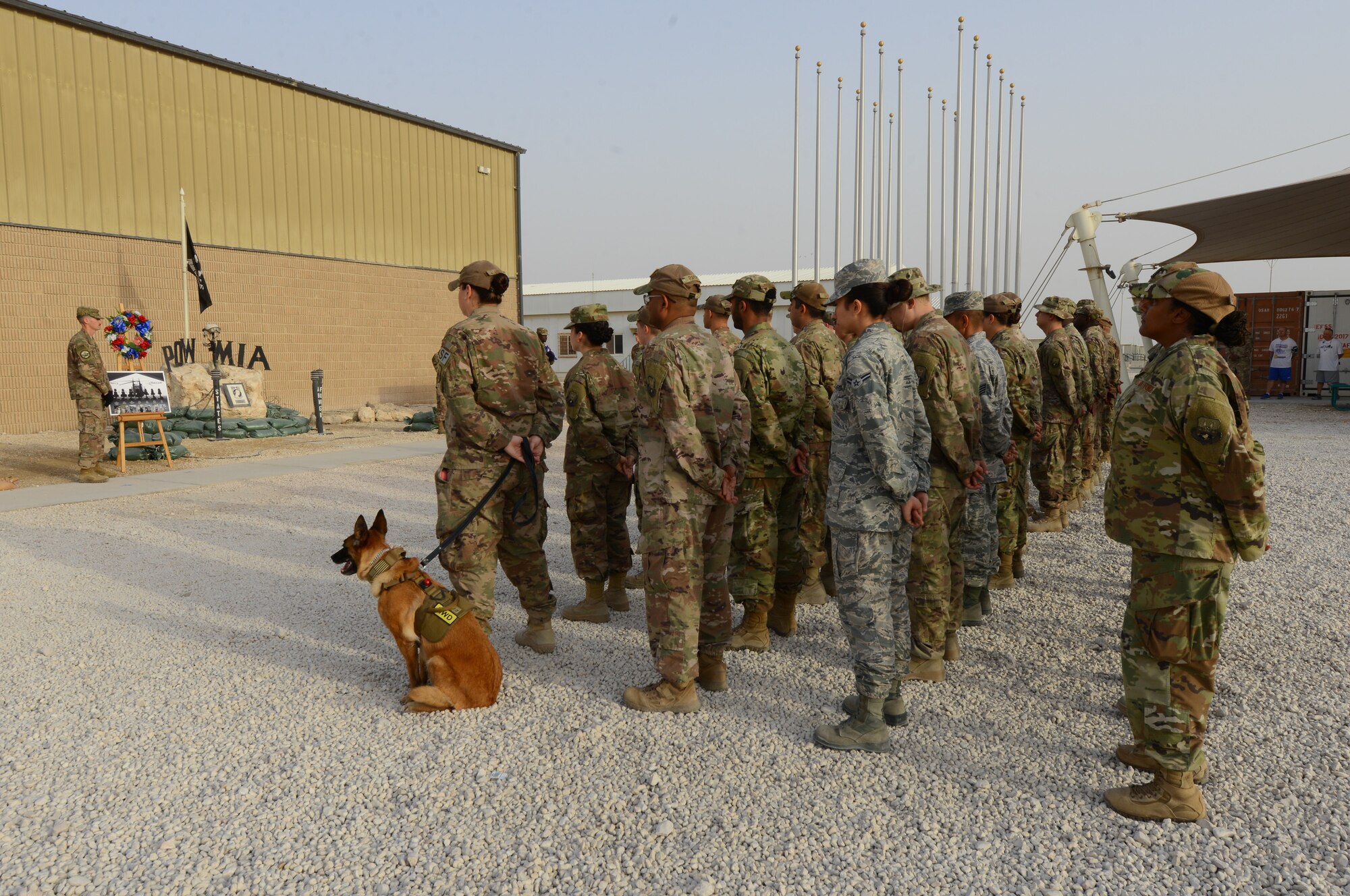 Airmen from Team Al Udeid stand in formation during a Memorial Day ceremony, Al Udeid Air Base, Qatar, May 24, 2018. The ceremony also recognized and honored all those who gave the ultimate sacrifice for our freedom. (U.S. Air Force photo by 1st Lt. Katie Spencer)