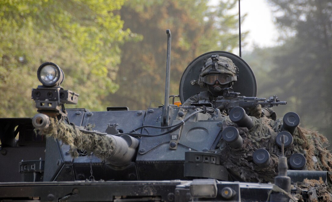A Polish Army soldier scans his surroundings