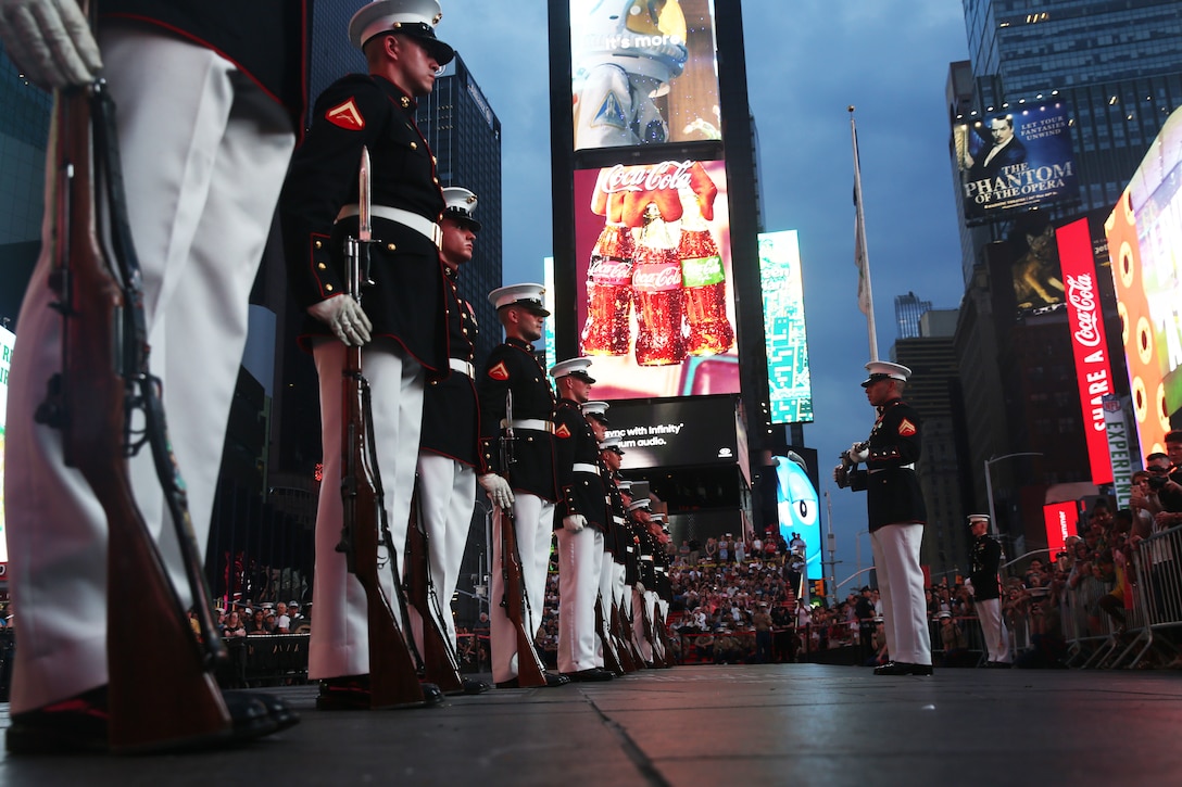 U.S. Marines with the United States Marine Corps Silent Drill Platoon, Battle Color Detachment, Marine Barracks Washington, D.C., perform precision rifle drill movements for the crowds during a USMC Battle Colors Detachment Performance during Fleet Week New York in Times Square, New York, May 26, 2018. Now in its 30th year, Fleet Week is the city’s time-honored celebration of the sea services. It is an unparalleled opportunity for the citizens of New York and the surrounding tri-state area to meet Marines, Sailors, and Coast Guardsmen, as well as witness firsthand the latest capabilities of today’s maritime services.