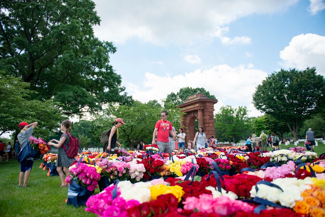 People gather around flowers.