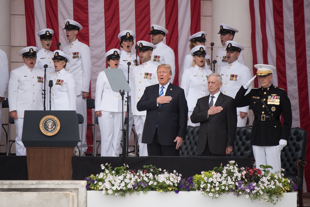 President Donald J. Trump, Defense Secretary James N. Mattis, and Marine Corps Gen. Joe Dunford, chairman of the Joint Chiefs of Staff, render honors during the 150th National Memorial Day Observance at Arlington National Cemetery, Va.